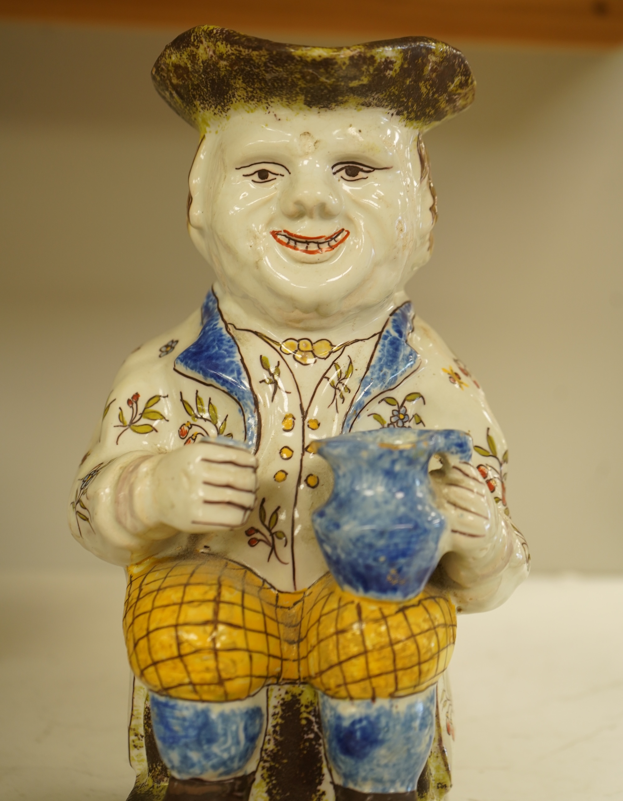 A French 'Rouen' Faience Toby Jug, 20th century, 25cm
